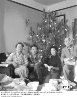 Mr. and Mrs. C. D. Hoy with son Jack and a daughter, possibly Star or Lily, at Christmas; circa 1...