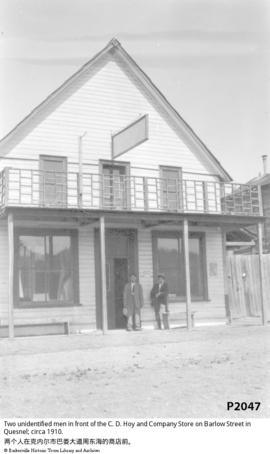 Two unidentified men in front of the C. D. Hoy and Company Store on Barlow Street in Quesnel; cir...