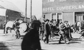 Band in a Funeral Procession in Front of the “Hotel Cumberland” in Cumberland B.C.