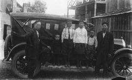 Unidentified Family of 6 (a Father and 5 Children) Near a Car