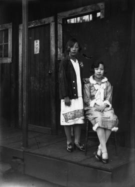 Ada and Dorothy Tso Outside of a Store (Pre 1929)