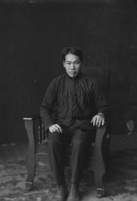 Unidentified Chinese Man Sitting in a Chair