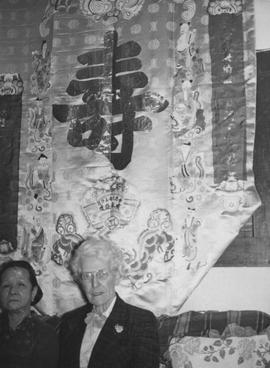 Mrs. Lowe and Mrs. Finch in Front of an Embroidered Tapestry